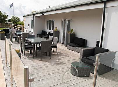 AB Sundecks Decking and Steel Glass with an array of tables and chairs