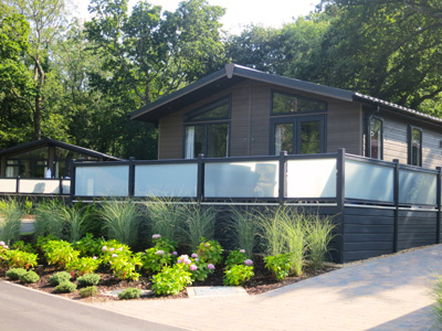 AB Sundecks Picket Glass on raised decking on water over looking the lake