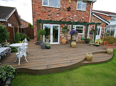 AB Sundecks Decking surrounding the back of a house